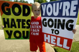 Westboro Baptist Church children holding God hates you sign.
