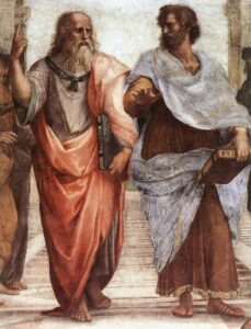 Plato (left) and Aristotle in Raphael's 1509 fresco, The School of Athens. Aristotle holds his Nicomachean Ethics and gestures to the earth, representing his view in immanent realism, whilst Plato gestures to the heavens, indicating his Theory of Forms, and holds his Timaeus